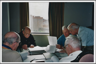 Kriegies compare notes
Pictured left to right around the table: Don Graul, ??, George Myron, "Doc" DiFrancesco, ??
